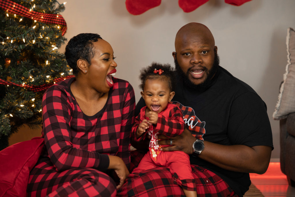 matching pajamas Buffalo plaid  Black family Christmas photoshoot